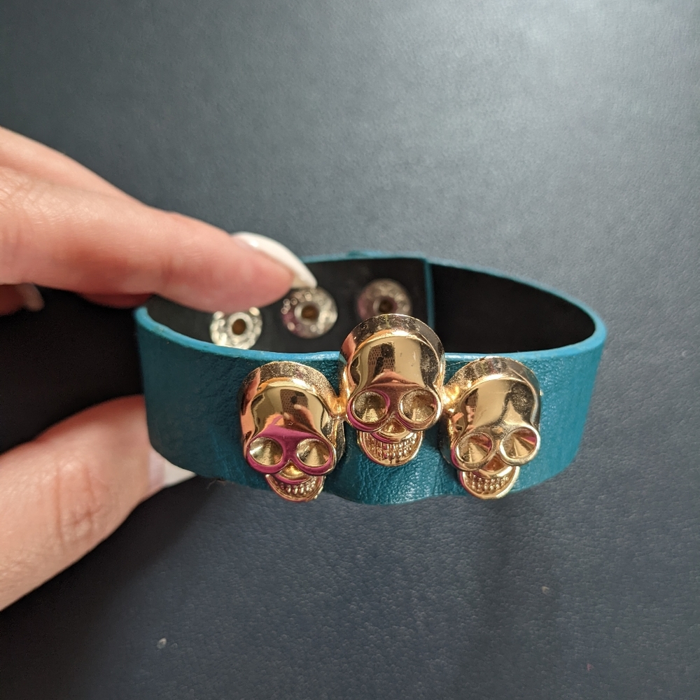Accessories 3/$12: Leather band with gold skulls